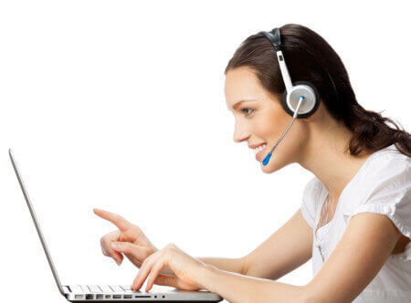 Woman with headset at laptop