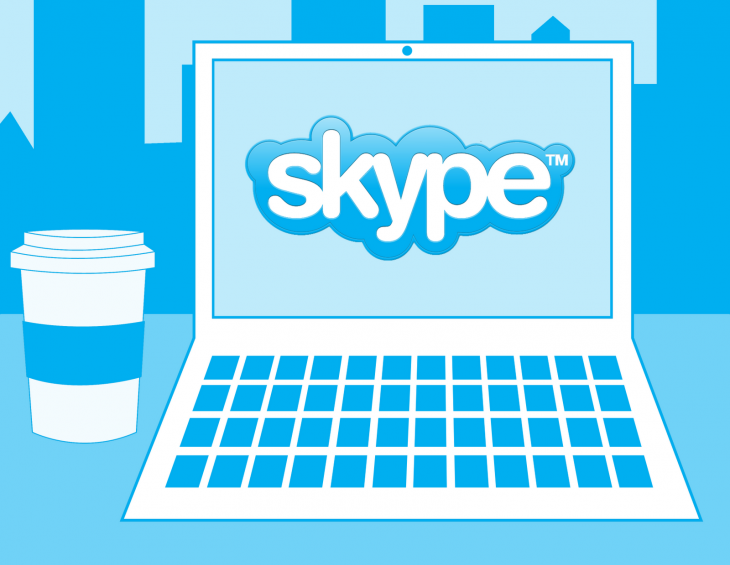 Skype logo on laptop with coffee